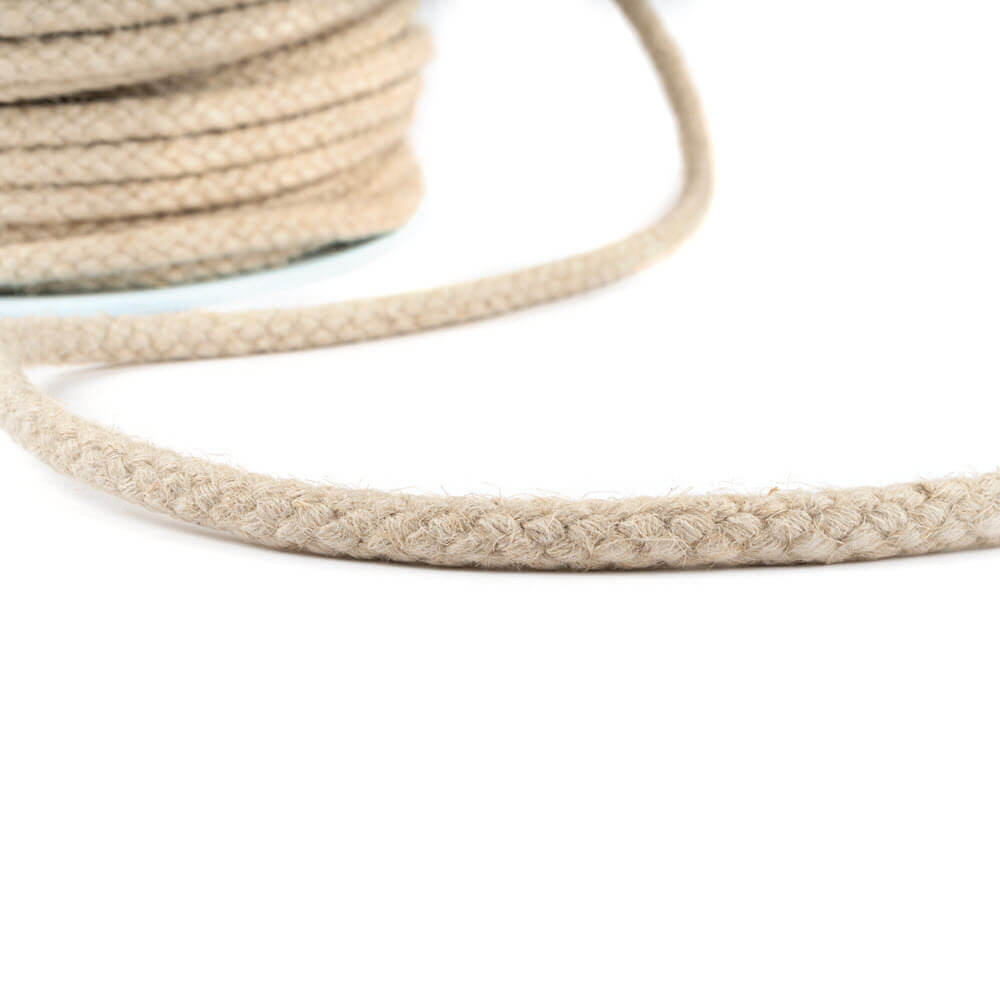Close-up of braided hemp rope on a white background