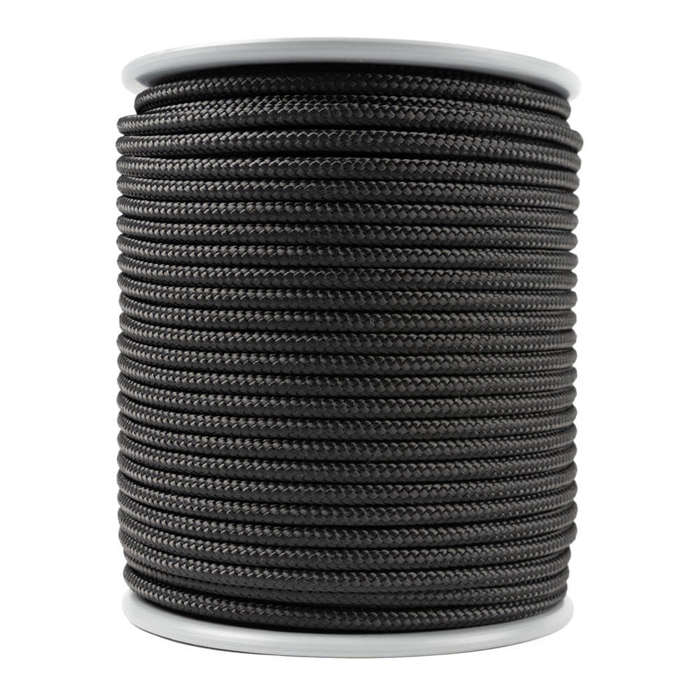Spool of black 4 mm kevlar rope on a white background