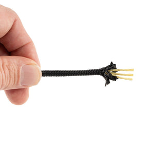 Hand holding a small black braided polyester with yellow kevlar strands against a white background