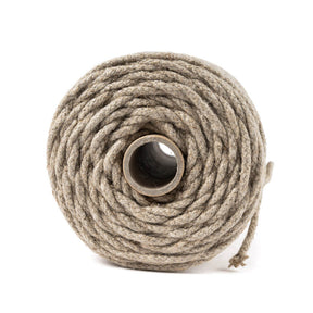 Coiled hemp rope on a white background